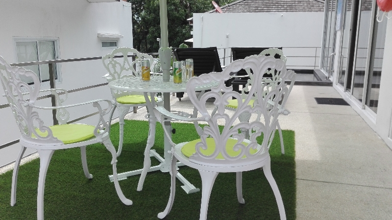 1- Terrace with living room, parasol, lawn and swimming pool, of the villa Paris 